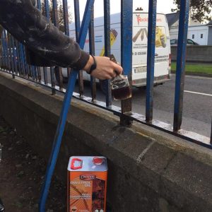 Owtatrol oil as a rust inhibitor being used on a metal fence