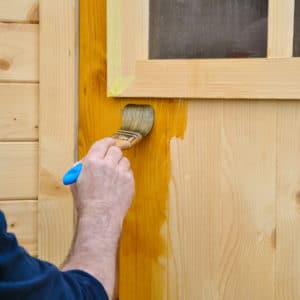 Aquadecks being applied to a garage door