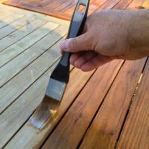 Deks Olje D1 being applied to a garden table