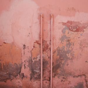 Mold and mildew on a pink wall