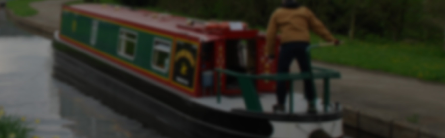 Man cruising on his narrowboat