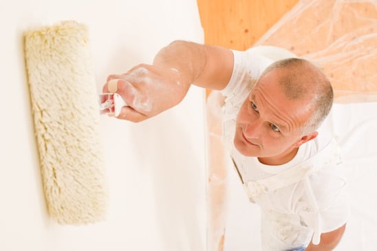 Man painting a wall