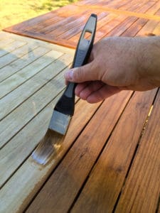 Deks Olje D1 being applied to a garden table