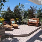 Garden deck with furniture and plants