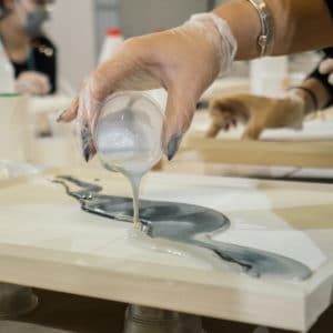 lady pouring out resin