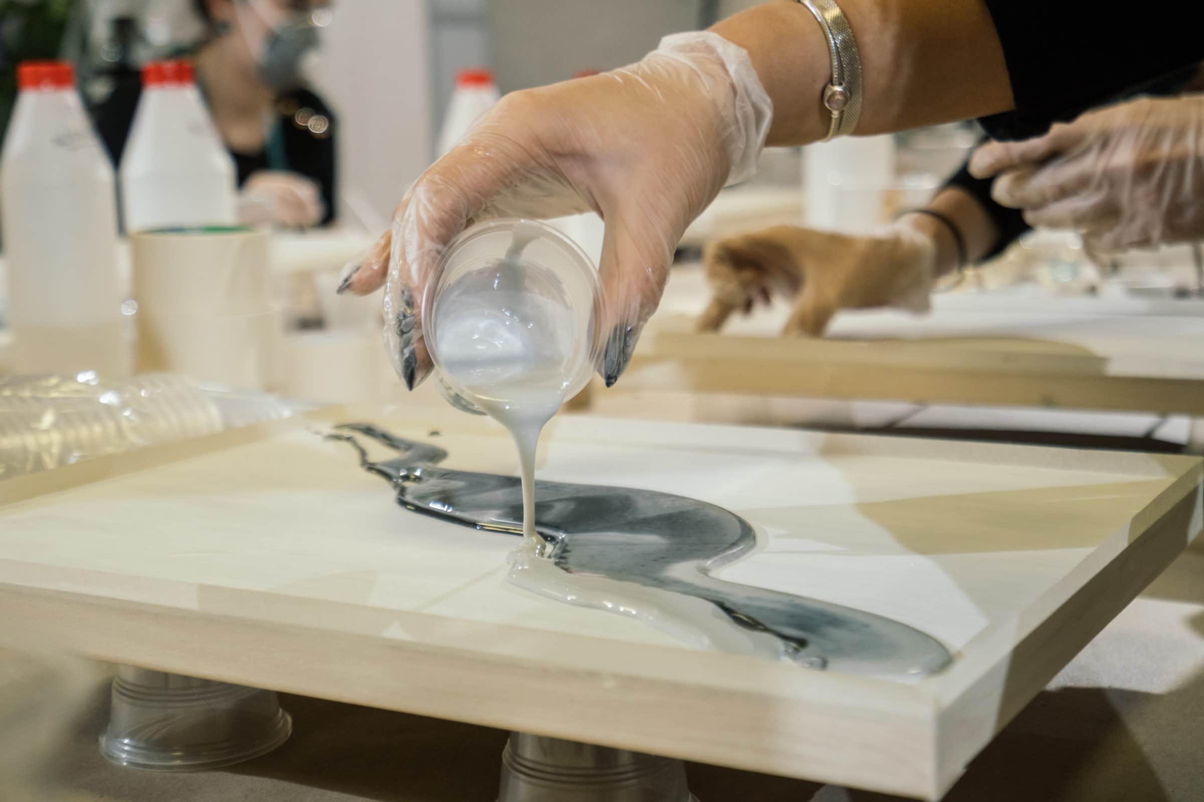 lady pouring out resin