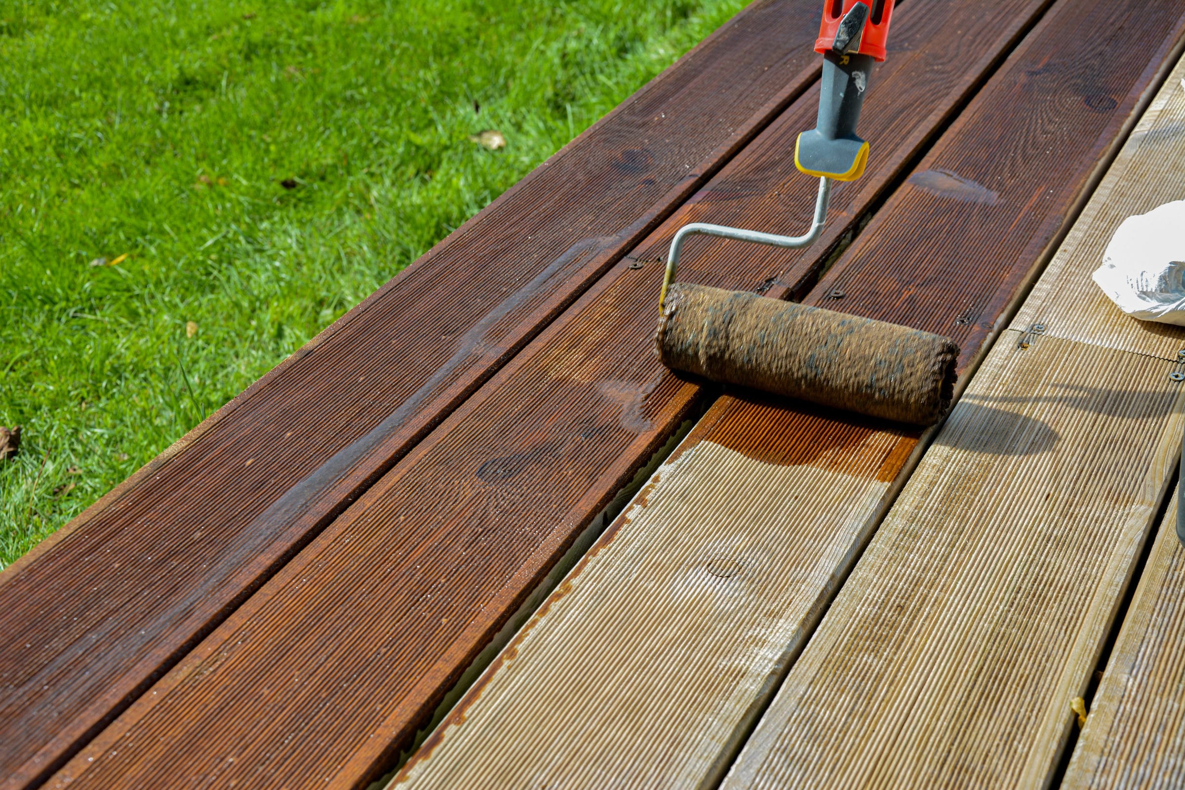 Textrol being applied to a deck with a roller